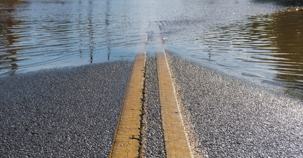 double solid yellow line on a road covered with water