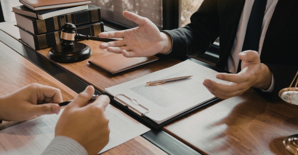A professional legal conversation taking place between two people.