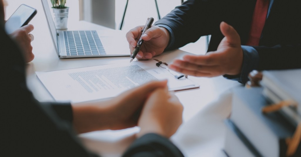 A person discussing business with a client.
