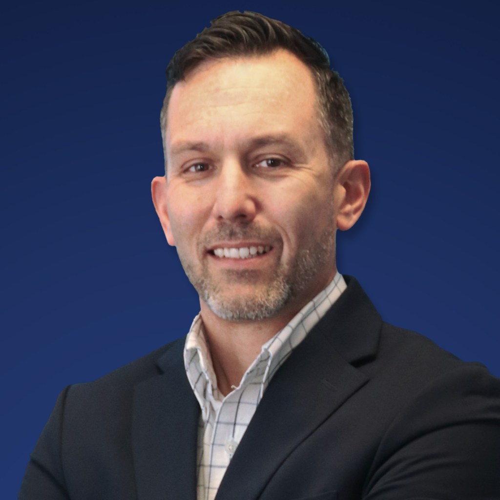 Headshot of Travis Wattie.