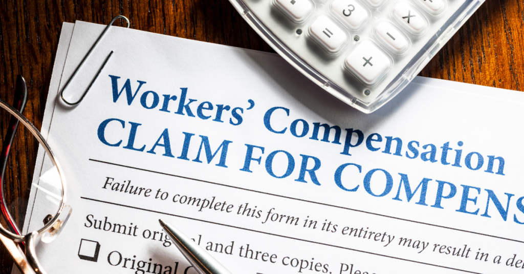 Paperwork on a table titled Workers' Compensation Claim for Compensation