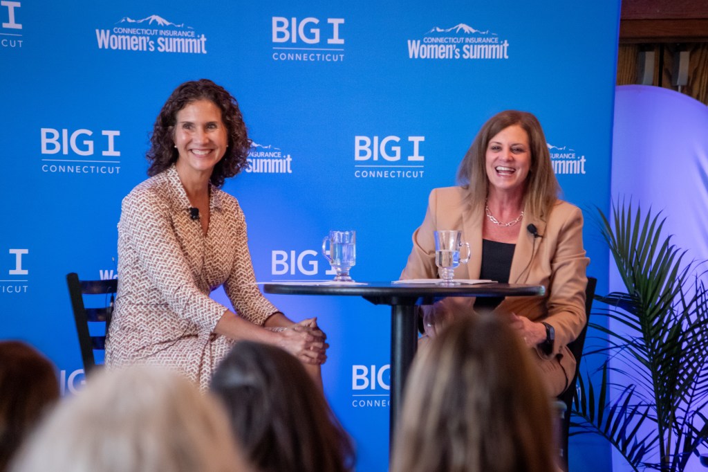 Lisa Lounsbury and Angela Ripley at the 2026 Connecticut Women in Insurance Summit speaking during the Fireside Chat: Breaking Barriers