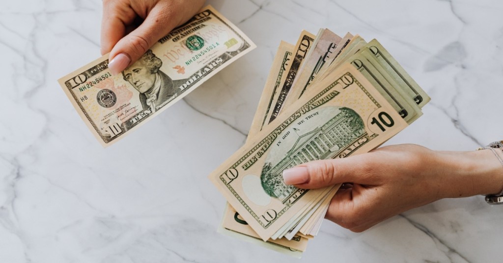 A person counting cash.