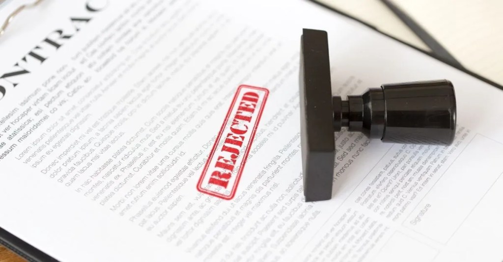 "Rejected" red stamp on a document.