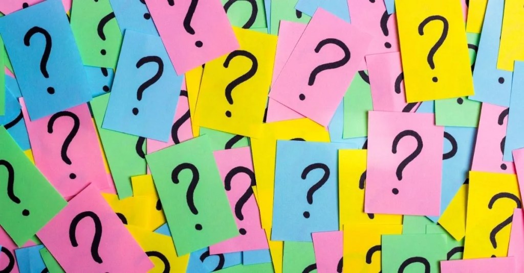 Question marks on sticky notes.