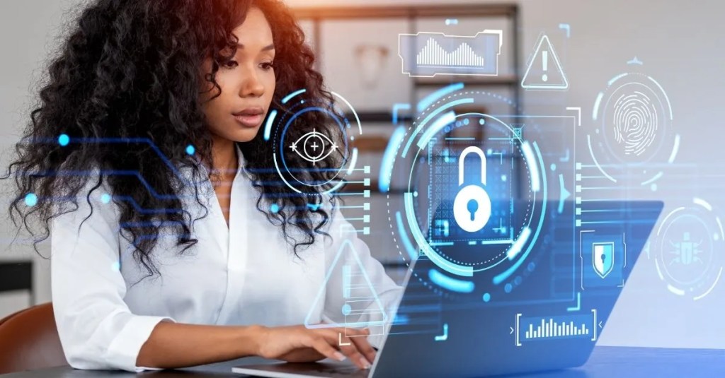 A woman working on computer with technology icons overlayed.