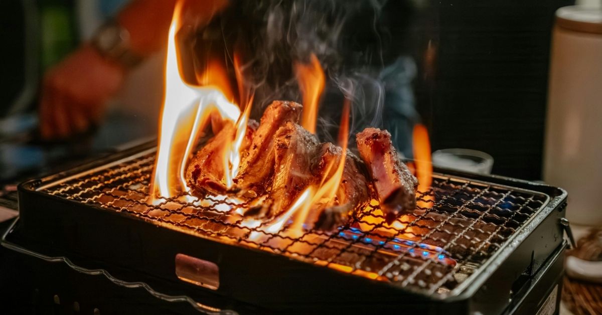 Grilling meat on a grill.